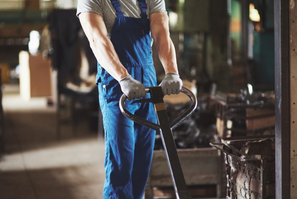 The employee of the plant carries out transportation of the goods